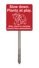 Load image into Gallery viewer, Tortoise Garden Sign – “Slow Down, Plants at Play” – Funny Acrylic Yard Sign with Stainless Steel Stake