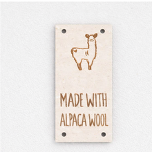 Load image into Gallery viewer, Label with alpaca illustration and 'Made with Alpaca Wool' text on a light background
