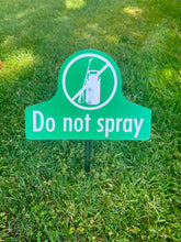 Load image into Gallery viewer, National Etching Do not spray garden sign in grass.