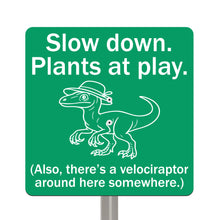 Load image into Gallery viewer, Velociraptor Garden Sign – “Slow Down, Plants at Play” – Laser Engraved Dinosaur Yard Stake
