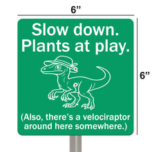 Load image into Gallery viewer, Velociraptor Garden Sign – “Slow Down, Plants at Play” – Laser Engraved Dinosaur Yard Stake
