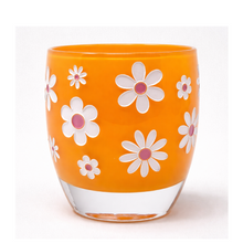 Load image into Gallery viewer, Orange glass votivewith white floral patterns on a white background

