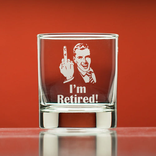 National Etching I'm Retired whiskey glass featuring a man's face and extended middle finger.