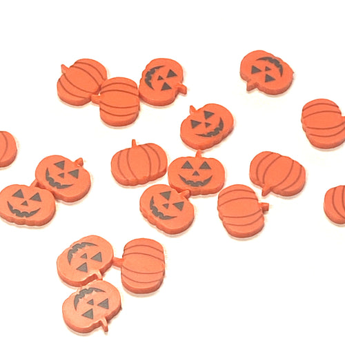 Orange acrylic pumpkin and jack-o'-lanterns are shown on a white background.